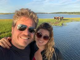 The Wild Horses are so Majestic! We took a fishing charter with Saltwater  Adventures in Ocean City, Maryland to see the wild horses of Assateague  Island. #travelblogger #maryland #OceanCity #travel #swsadventures  #swsportsman