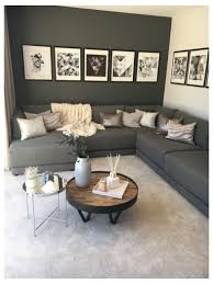 Gray being a highly versatile color has the ability to work well with a number of accent colors. Strata Intrigue Lounge Decor Grey Walls A Dark Grey Contrast Wall And Statement Grey Sofa In 2021 Grey Sofa Living Room Black Living Room Living Room Decor Gray