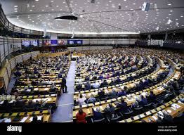 In this Wednesday, Jan. 29, 2020 photo, Al Rehder, left, talks with Larry  Koland in Rehder's car condo at the Eagan Car Club in Eagan, Minn. Behind  Rehder's 1939 Ford is a