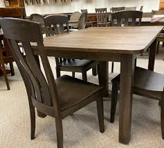 Charthouse rectangular dining table, 4 upholstered side chairs and bench. Dining Tables