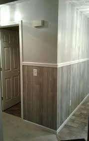 It's applied in a form of narrow slats to give an understated twist. Wood Panel For Half Wall Wall Paneling Makeover Paneling Makeover Wood Paneling Makeover