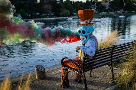 Maybe you would like to learn more about one of these? Hd Wallpaper Person Wearing Skull Mask Costume Sitting On Bench Man Wearing Human Skeleton Mask While Sitting On Bench Near Body Of Water Wallpaper Flare
