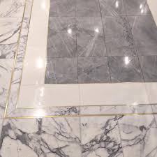 Here S A Great Design In Our Brass Inlay Marble Tiles With White Thassos Marble Border And Blue De Sav Marble Flooring Design Marble Floor Pattern Marble Inlay