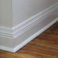 A baseboard height that's approximately 7% of the wall height provides for a solid and definable base without being too big. Add Height To Your Short Baseboards Cheaply Baseboards Baseboard Styles Townhome Remodel