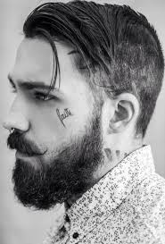 Kleine tattoo männer kleines tattoo brust tattoo ideen oberarm tattoo tattoos vorlagen tattoos zeichnen tattoo rücken inspirierende tattoos schnurrbart vollbart haarige kerle herren mode bärtiger mann mit tattoos bärtige männer behaarte männer tatoo. Tattoo Am Gesicht Aus Kleinem Schrift Von Mann Mit Bart Gesichtstattoos Bart Tattoo Barte Und Haare