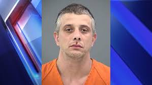 Man dead after Lawrence drone purchase; suspect in custody