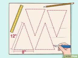 Apply glue or tape to the outside edges (the decorated side edges) of all the tabs. 3 Ways To Build A Pyramid For School Wikihow
