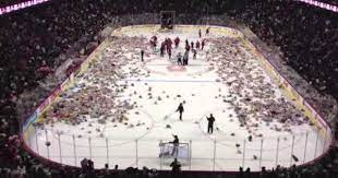 Watch 21 453 Stuffed Animals Fly In A Hockey Rink Video Calgary Flames Hockey Hockey Games