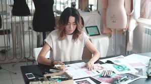 Designer Draw Sketches In The Studio Workspace Designer Fashion Designer Works In The Atelier By Nskfoto Fashion designers can work on a commercial level or produce pieces for runway and. designer draw sketches in the studio workspace designer fashion designer works in the atelier