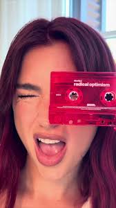 Excited Dua Lipa with her new album Radical Optimism. She's unboxing it..
