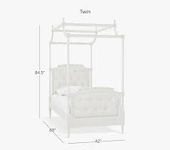 Simply hang sheer drapery panels on wire rope threaded through eye hooks in the ceiling and accent with strings of cascading holiday lights. Blythe Kids Tufted Canopy Bed Pottery Barn Kids
