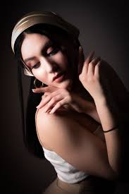 A portrait of happiness with a bow in her hair