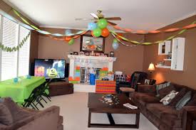 Streamers And Balloons Create A Party Atmosphere In The Living Room Monster Birthday Birthday Room Decorations Popular Living Room Table Decor Living Room