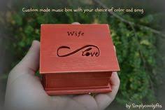 Write your musical note on the paper strip, and use the puncher to punch the holes.then put it inside the music box movement and stir the shaft,then it can make sound. 8 Custom Made Wedding Ring Boxes Jewelry Boxes Music Boxes Ideas Music Box Wooden Music Box Music