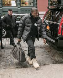 Street style at the kanye west x adidas show. Kanye West Swaps Out The Man Bag For The Dad Duffel Vogue