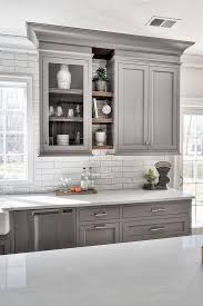 You can't go wrong with large hexagonal tiles, seen in this kitchen in a deconstructed pattern for a note of insouciance in tasteful shades of gray. 25 Ways To Style Grey Kitchen Cabinets