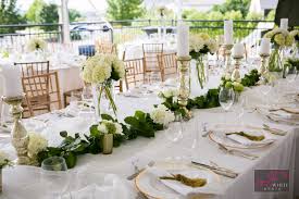 White Hydrangea And Green Leaf Table Runner White Floral Wedding Centerpieces And Candles With A Touch Wedding Floral Centerpieces Leaf Table White Hydrangea