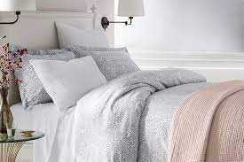 Some quilts are handmade from remnant fabrics to create a colorful design for the top of the bed. How To Layer Bedding The Seasonless Layered Bed Threads By Garnet Hill