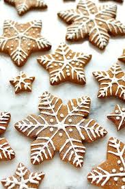 Gingerbread Star And Snowflake Cookies With Royal Icing Designs Gingerbread Icing Christmas Cake Recipes Snowflake Cookies Decorating