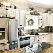 9 New Ideas For Decorating Above Your Kitchen Cabinets Decorating Above Kitchen Cabinets Kitchen Cabinets Decor Above Kitchen Cabinets