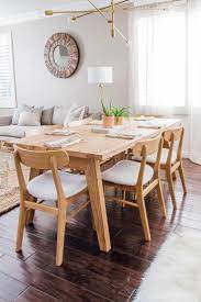Round wooden table served with plates, forks and glasses at kitchen. Pin On Tisch