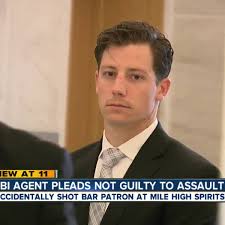 Dancing FBI agent accused of accidentally shooting Denver man pleads not  guilty