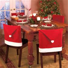 Ornaments, wreaths and string lights are holiday party staples, but you can definitely have a fabulous christmas affair without them.for a modern take, switch up the color scheme and take it up a notch. Buy Generic Red 1pcs Santa Clause Cap Red Hat Chair Back Cover Christmas Dinner Table Decor Party Xmas Home Decoration Online At Low Prices In India Amazon In