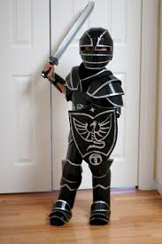 How To Make Your Kid A Cardboard Knight In Armor Cardboard Costume Halloween Costumes College Easy College Halloween Costumes