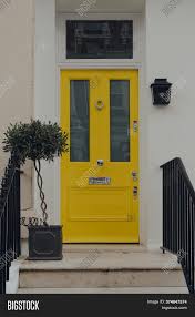 An ordinary home can become the house with the red door with nothing more than a simple coat of paint, while a a pivoting outer frame reveals a smaller door within, the smaller door adhering to traditional sizing and the outer door blurring the. London Uk June 20 Image Photo Free Trial Bigstock
