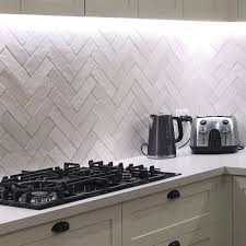 A kitchen backsplash is a perfect time to add a pop of color to your herringbone tiles. Artisan Alabaster Gloss 6 5x20 Kitchen Splashback Splashback Kitchen Ideas Herringbone Tiles Kitchen