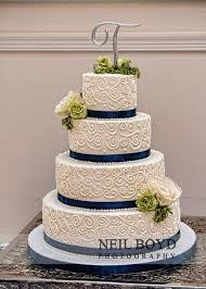 The Classic White Tiered Wedding Cake With Navy Blue Ribbon And Floral Accents Wedding Weddingca Wedding Cakes Blue Wedding Cake Navy Navy Blue Wedding Cakes