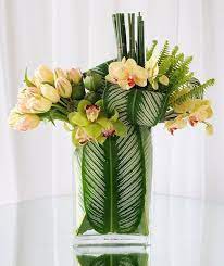 Maybe you would like to learn more about one of these? 7 Tulip Arrangements That Are Absolutely Stunning Tulips Arrangement White Flower Arrangements Contemporary Flower Arrangements