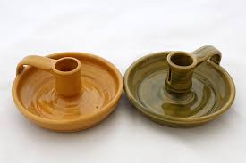 The emory features a traditional taper candle holder, complete with curving handle and lustrous saucer, in a timeless brass finish. Candle Holder Handled Plimoth Patuxet Museum Shop