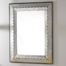 Hung from a black painted ceiling, vintage cage sconces light a galvanized metal mirror hung from a white. Pin On Spec House