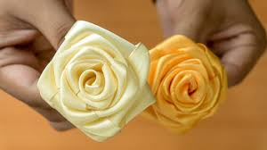 Now, cut this off, this extra ribbon, were going to leave just a little bit of a tail, and this is where youre going to use your pearl topped boutonniere pins. Realistic And Super Easy Ribbon Roses Wedding Diy Flowers Youtube