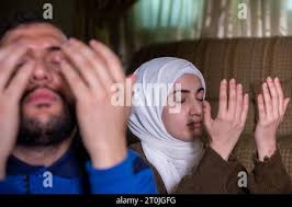 muslim man and woman asking for forgiveness during ramadan kareem. eid  mubarak Stock Photo