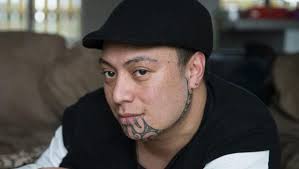 Man with facial tattoo rises above flak