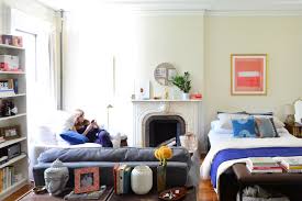 How To Throw A Party When Your Living Room Is Also Your Bedroom Living Room Toy Storage Furniture Comfy Living Room Living Room Toy Storage