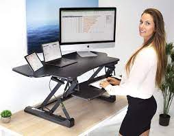 Learn more with our detailed and thorough reviews of sit stand desks. Amazon Com Mount It Height Adjustable Standing Desk Converter 48 Wide Tabletop Sit Stand Desk Riser With Gas Spring Stand Up Computer Workstation Fits Dual Monitors Black Mi 7925 Office Products