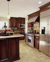 a luxury kitchen with cherry cabinets