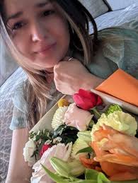 Celebrating birthday with flowers at the cemetery