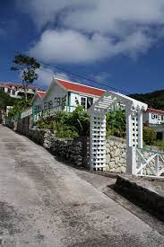 Flossie S Cottage Juliana S Traditional Saba Rental Cottage Cottage Brick Hearth Green Shutters