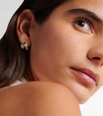 Floating Bezel 18kt gold hoop earrings with diamonds in gold