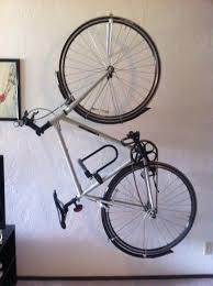 Wall Mounted Bike Rack That Allows Bike To Be Vertical And Parallel To Wall Bike Rack Wall Wall Mount Bike Rack Vertical Bike Rack