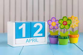 May 1st. Image of may 1 wooden color calendar on white background with flowers. Spring day, empty space for text. International Workers Day — Stock Photo © bychykhin #104765112