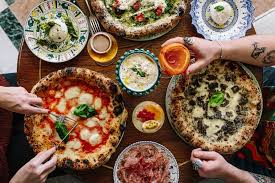 Family are cooking pizza and preparing homemade italian food. 21 Of The Best Italian Restaurants In London