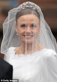 Olivia Henson is a bridal beauty in Emma Victoria Payne gown containing a  nod to her ancestors and a tiara from the Duke of Westminster's family  vault as she seals her marriage