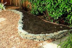 Pin By Ann M On Garden Stone Walls Garden Garden Services Landscaping With Rocks
