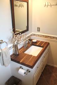 Look through wood bathroom countertops pictures in different colors and styles and when you find some wood bathroom countertops that inspires you, save it to an ideabook or contact the pro who. Small Bathroom With Walnut Wood Countertop Www Engraintops Com Wood Countertop Bathroom Small Bathroom Sinks Wooden Bathroom Countertop