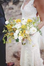 Looking for the perfect sunflower wedding bouquet? Organic And Free Flowing White Yellow And Green Wedding Flowers Brides Floral W Yellow Wedding Flowers Yellow Wedding Bouquet Yellow Wedding Inspiration